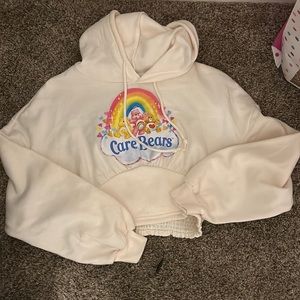 Size xtra small and an off white color